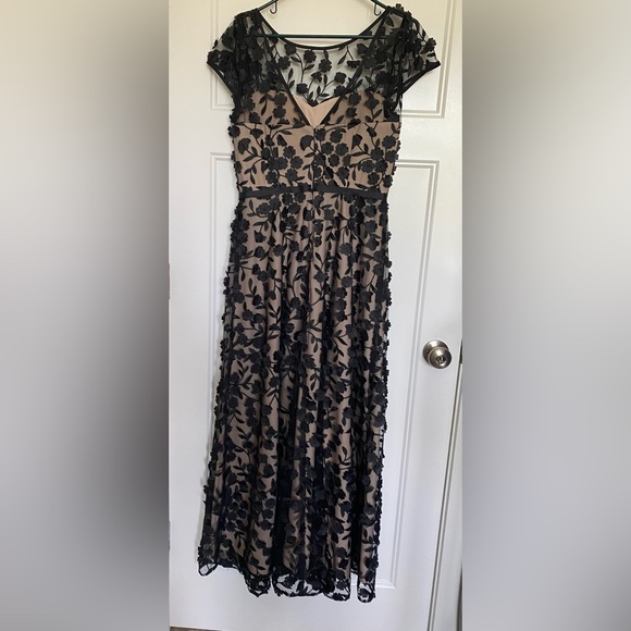 BHLDN nude gown with black mesh overlay, embroidery, and floral appliqué. - Picture 3 of 7